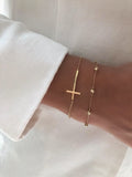18k solid gold cross bracelet and gold beaded bracelet